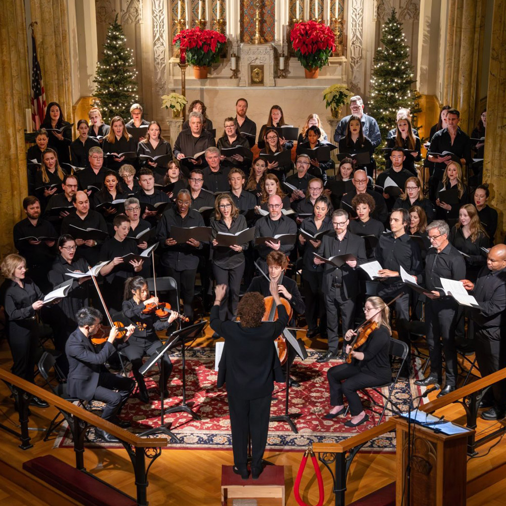 Choir Essential Voices USA performing with a string quartet